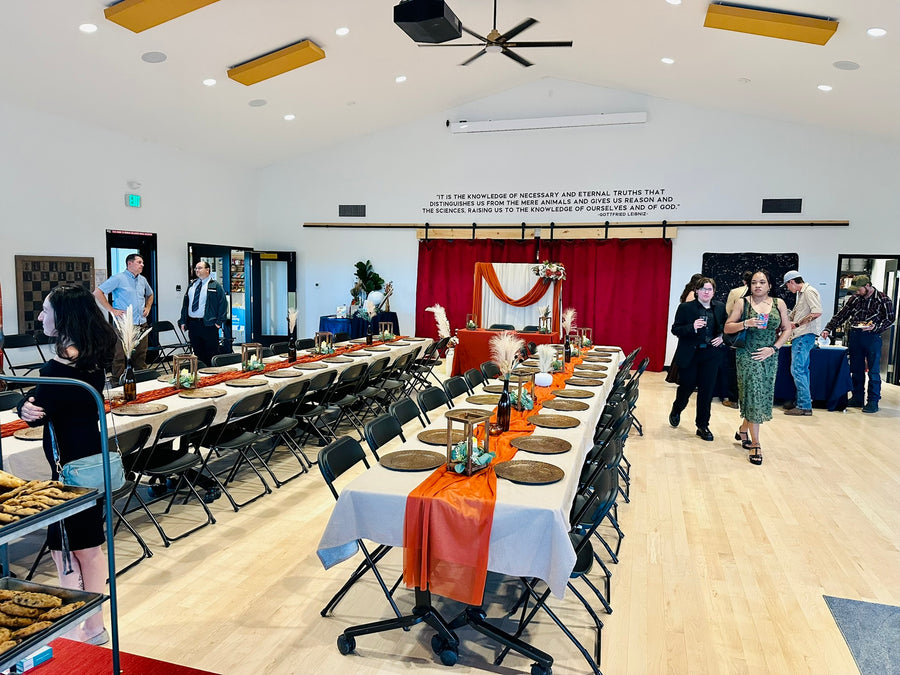 Guests mingling in the clubhouse reception hall at a wedding, Observer Ranch Penrose Colorado