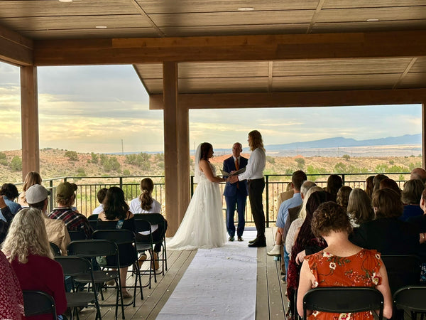 Wedding ceremony on the covered mountain-view deck at Observer Ranch, Penrose Colorado
