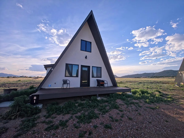 Sirius A-frame cabin at dusk under Colorado skies at Observer Ranch