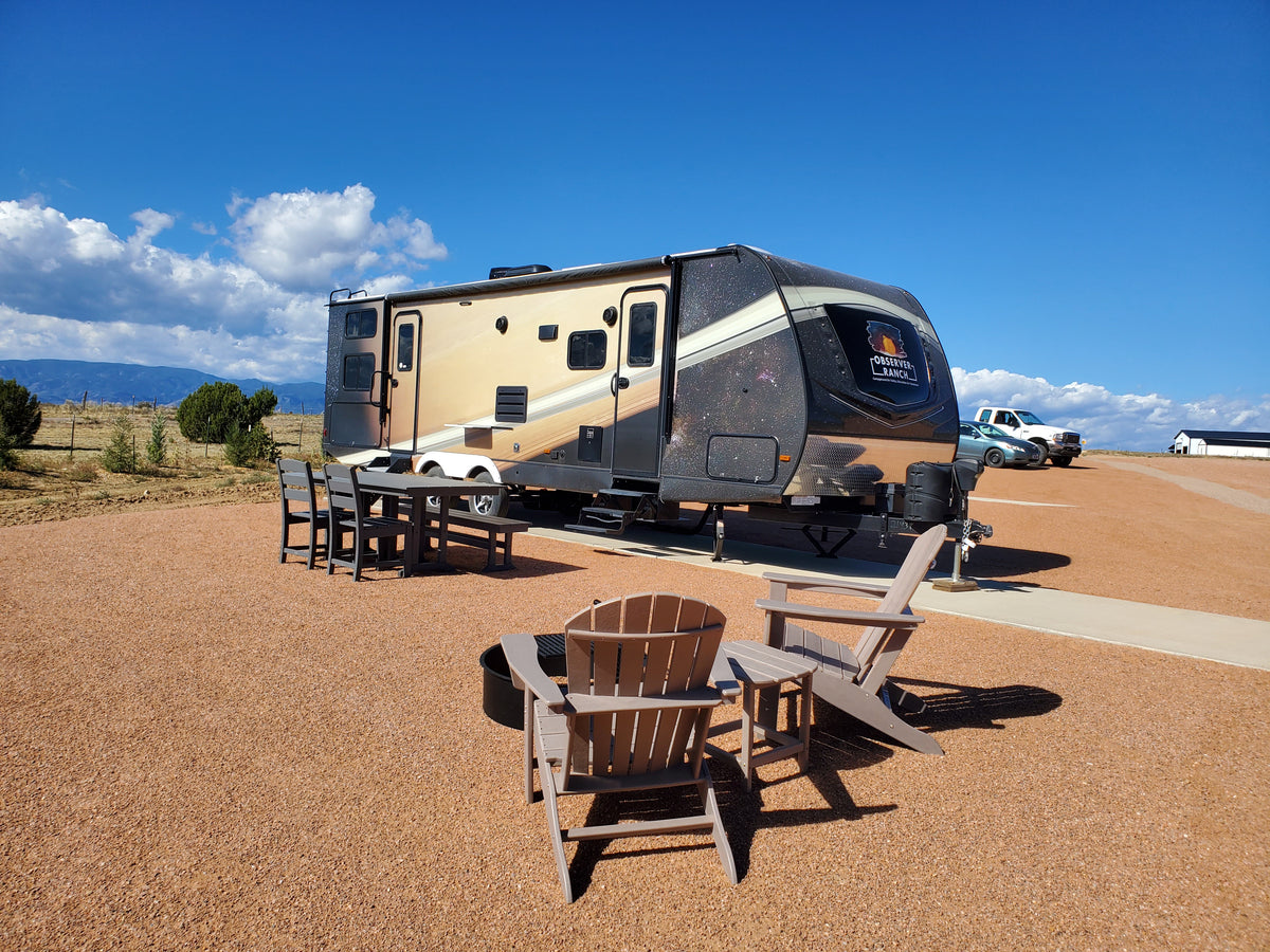 Saturn planet camper with rings vinyl wrap exterior and campsite seating